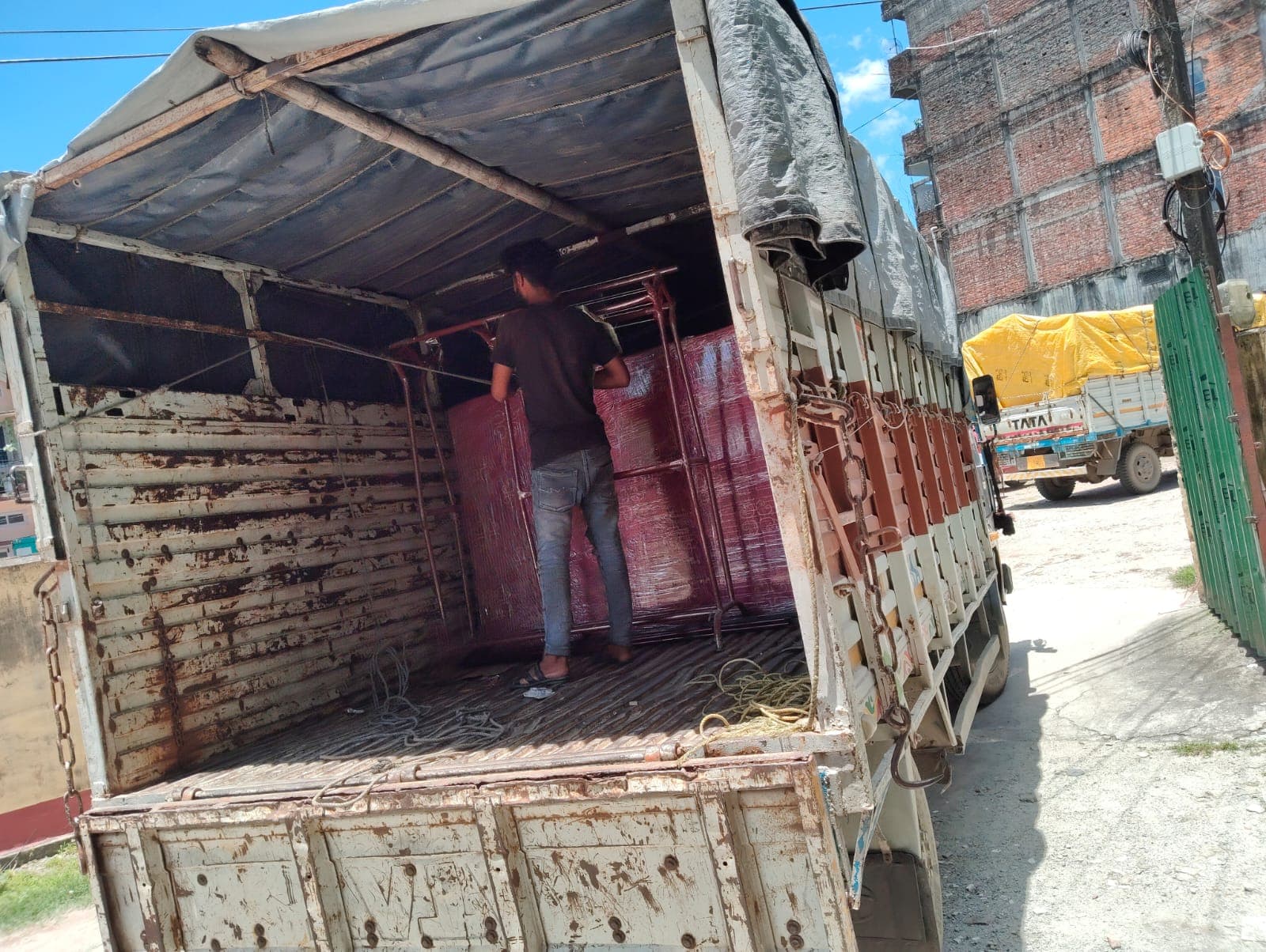 Movers loading furniture and household goods into transit truck