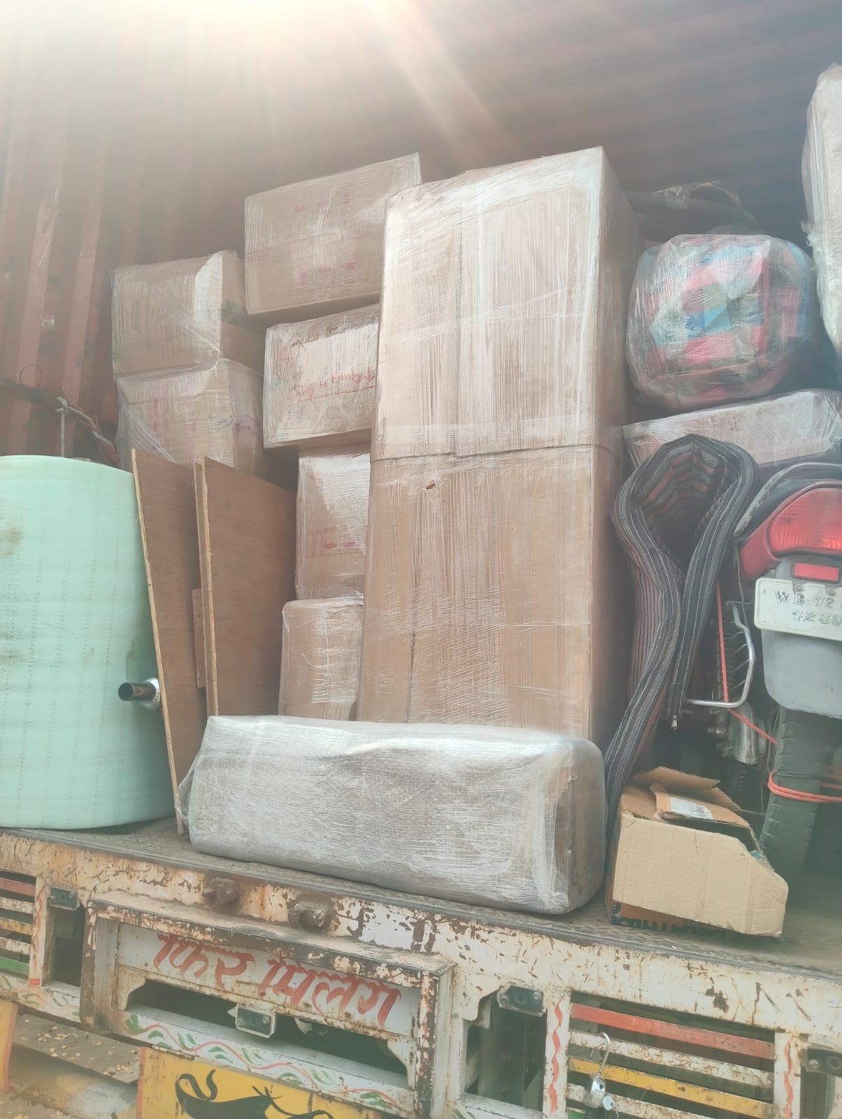Movers wrapping delicate items